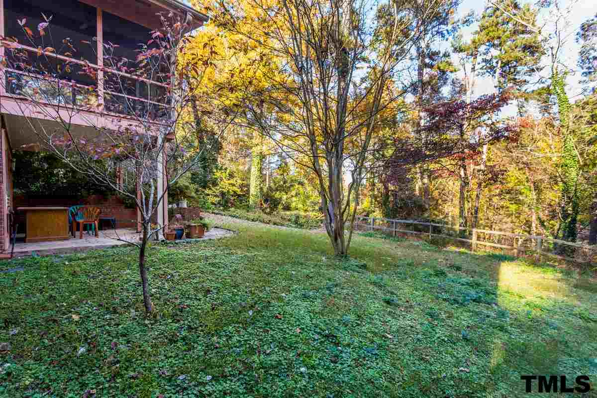 114 Longview Lake Drive Raleigh, NC 27610 - Photo 22 of 25 a backyard of a house with lots of green space