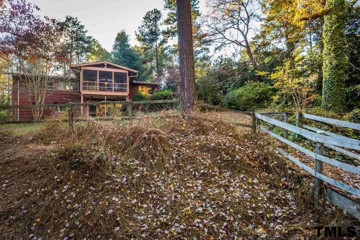 114 Longview Lake Drive Raleigh, NC 27610 - Photo 23 of 25 a view of a house with backyard and trees