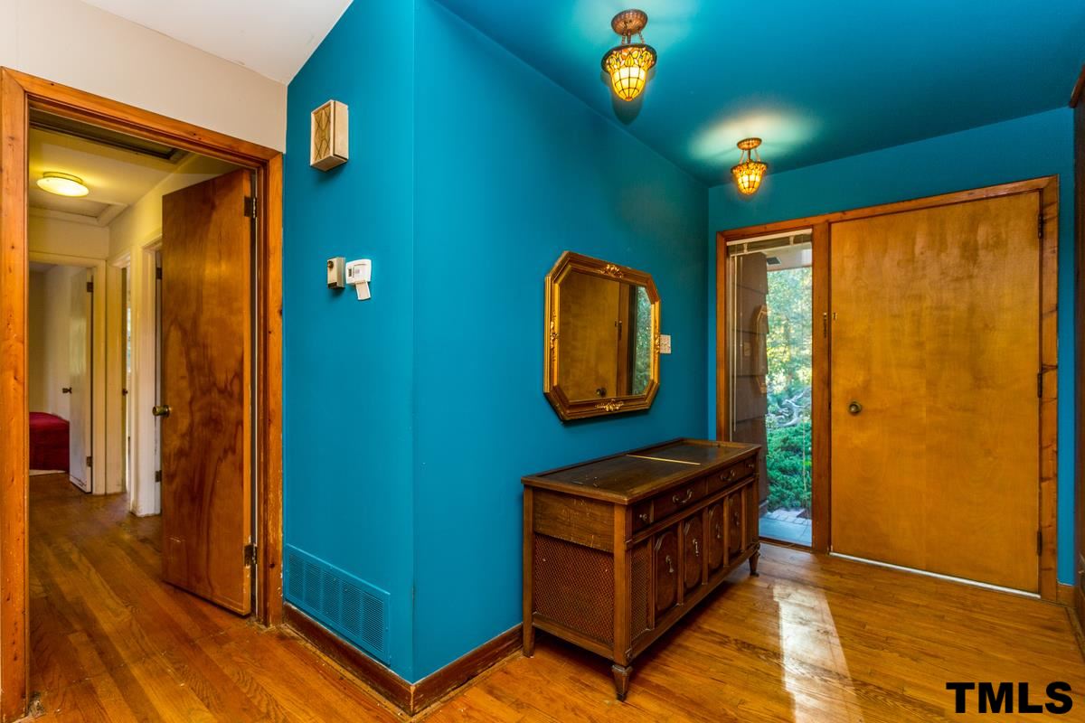 114 Longview Lake Drive Raleigh, NC 27610 - Photo 3 of 25 a view of room with window and wooden floor