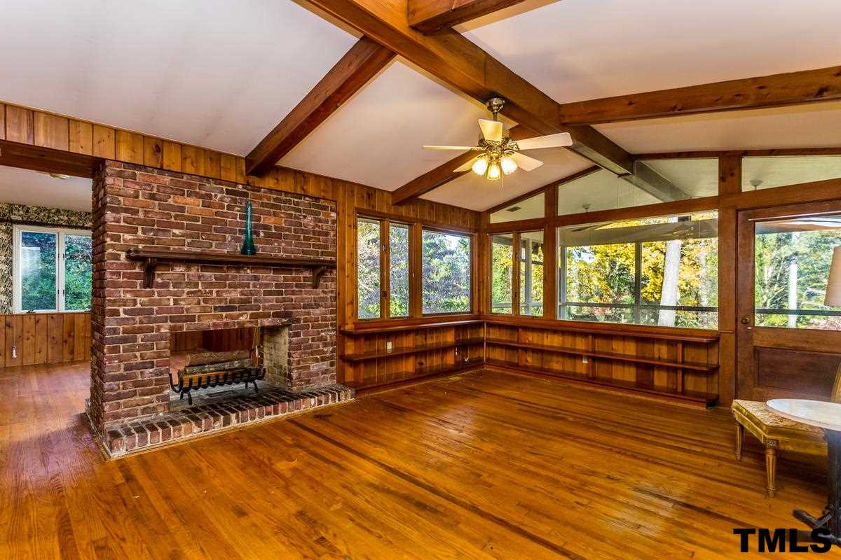 114 Longview Lake Drive Raleigh, NC 27610 - Photo 4 of 25 a outdoor space with wooden floor and a fireplace