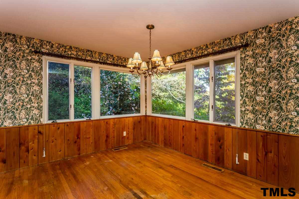 114 Longview Lake Drive Raleigh, NC 27610 - Photo 8 of 25 a view of an empty room with wooden floor and a window