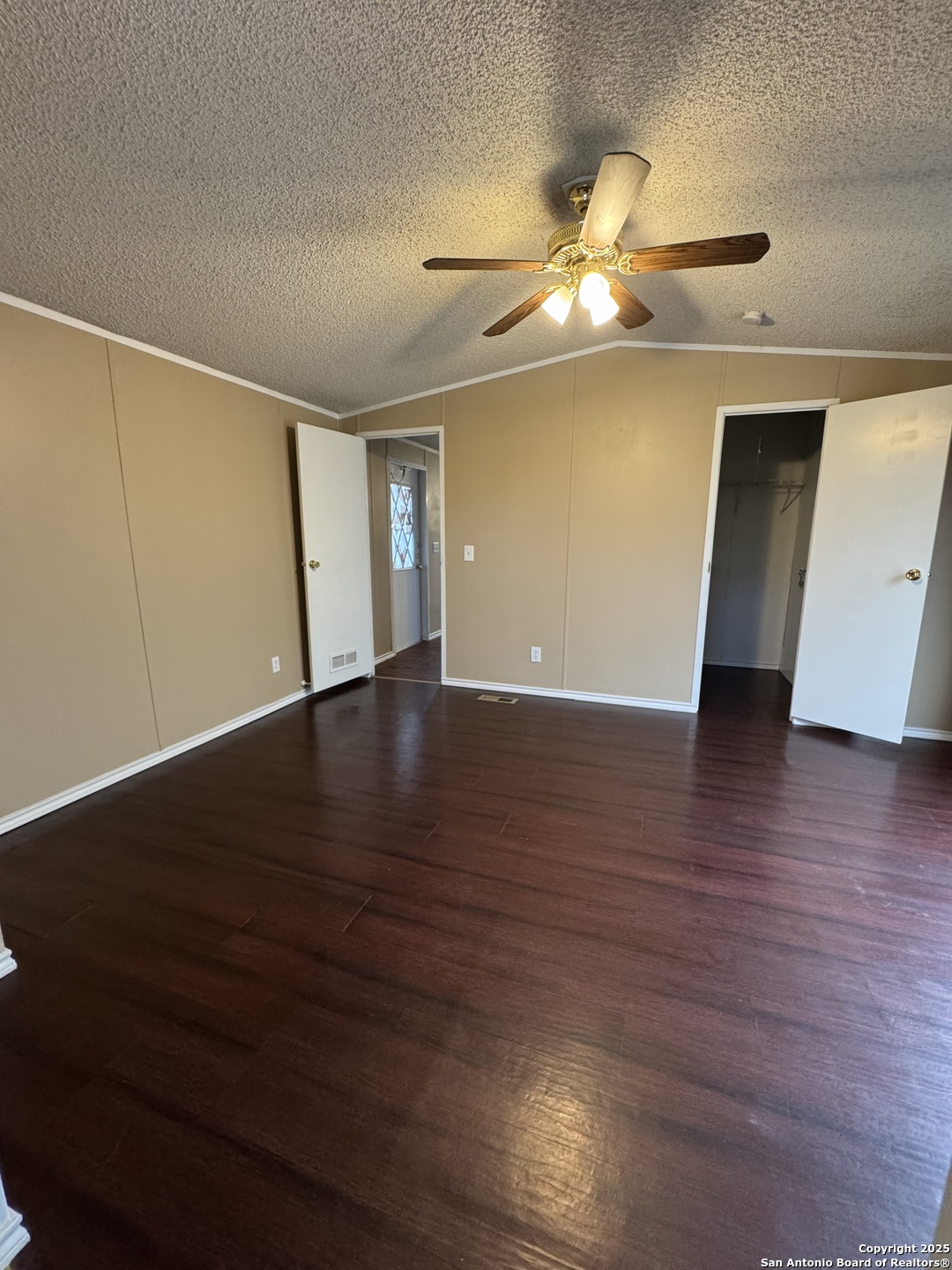 110 Deer Park Road, Unit B La Vernia, TX 78121 - Photo 11 of 12 a view of an empty room with wooden floor
