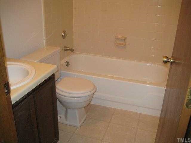 4536 New Hope Road Raleigh, NC 27604 - Photo 5 of 7 a bathroom with a sink a toilet and bathtub