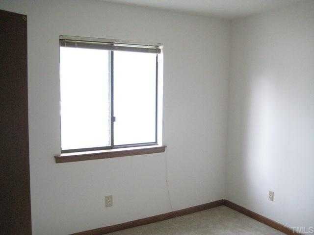 4536 New Hope Road Raleigh, NC 27604 - Photo 6 of 7 an empty room with a window