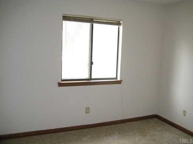 4536 New Hope Road Raleigh, NC 27604 - Photo 7 of 7 an empty room with a window
