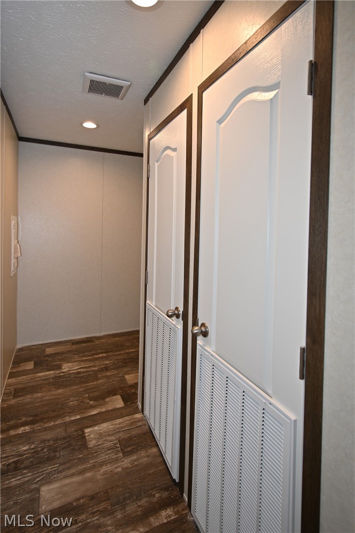4534 Lake Road East, Unit 71 Geneva, OH 44041 - Photo 22 of 26 Hall featuring dark wood-type flooring and a textured ceiling
