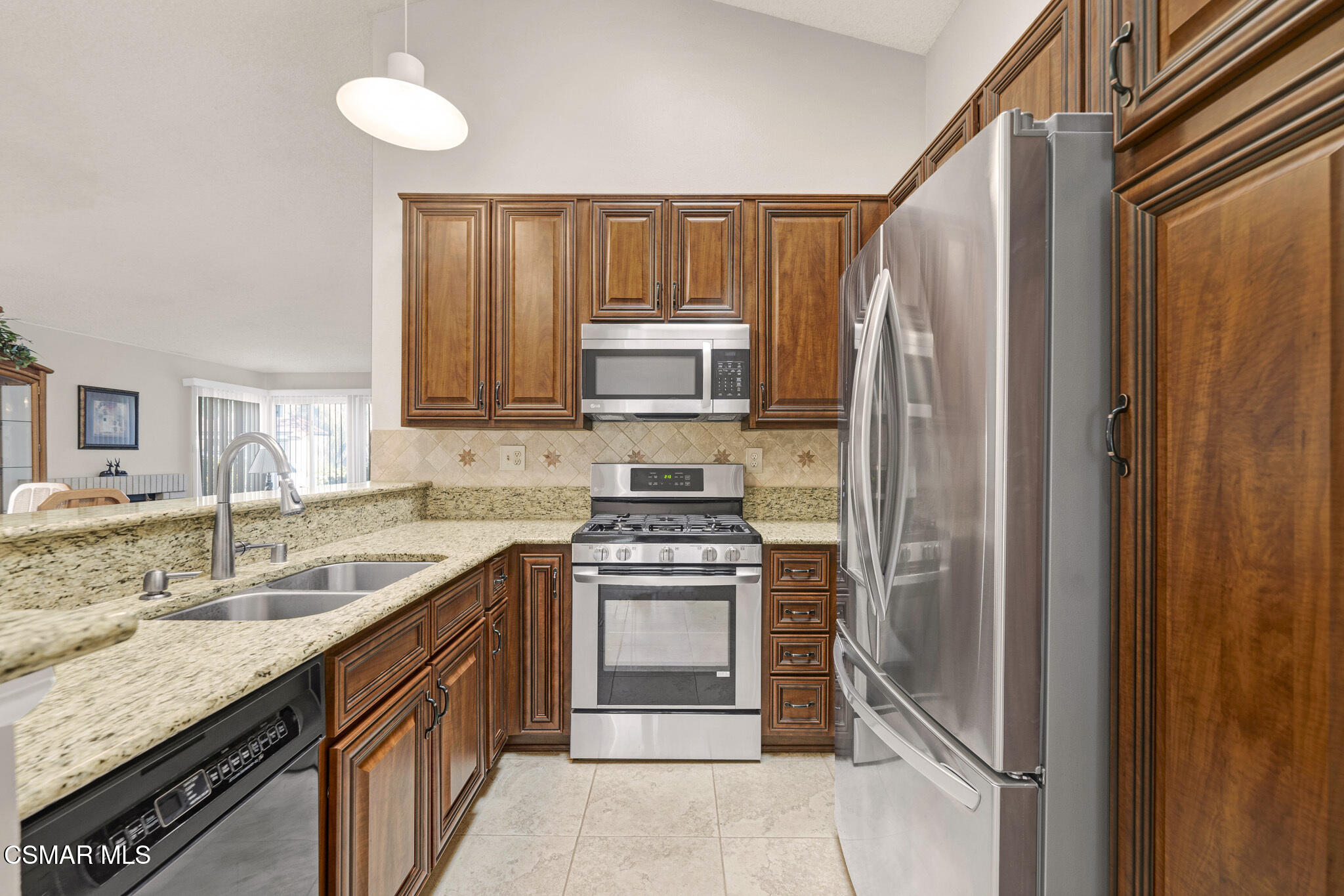2375 Oak Haven Avenue Simi Valley, CA 93063 - Photo 8 of 34 a kitchen with a sink stove and refrigerator