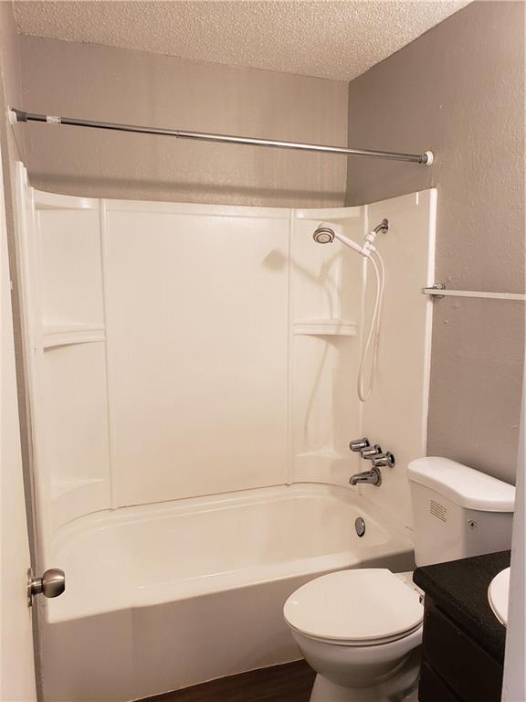 2304 Cedrick Cove, Unit B Austin, TX 78748 - Photo 7 of 7 a bathroom with a toilet and a shower
