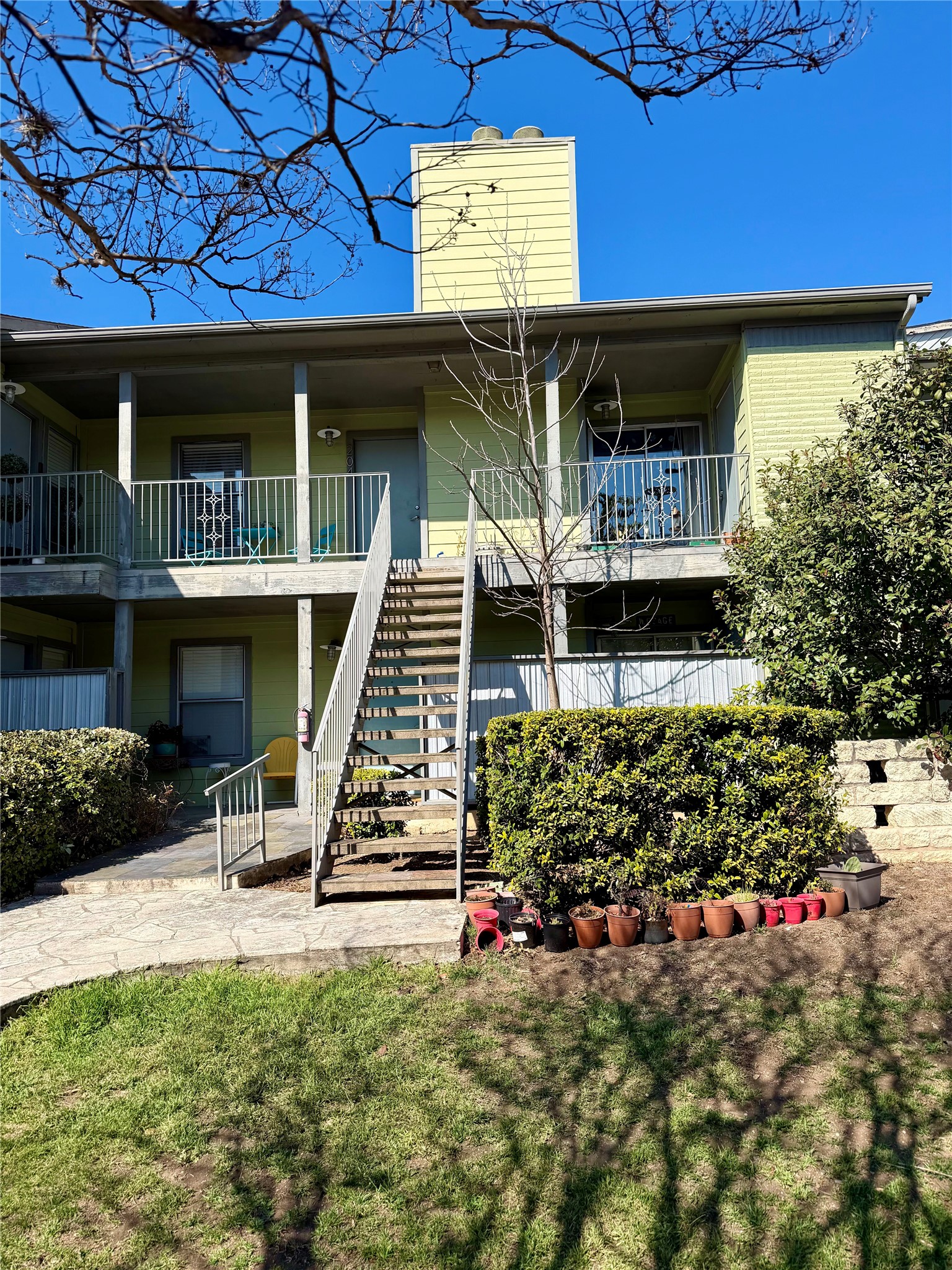 View of apartment building / complex with stairs