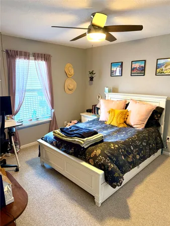 a bed sitting in a room next to a window