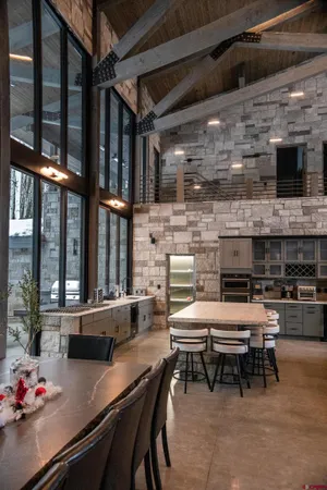 a kitchen with granite countertop a stove and a refrigerator
