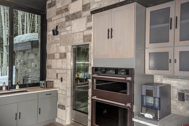 a kitchen with a stove and a sink