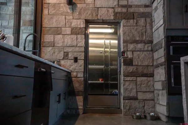 a kitchen with stainless steel appliances granite countertop a sink and a stove