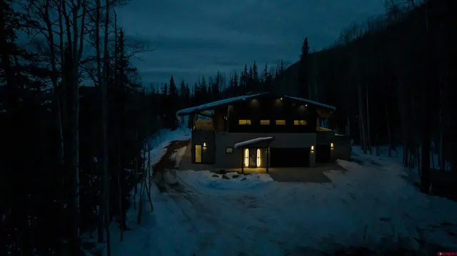 a kitchen with kitchen island a sink stainless steel appliances and cabinets