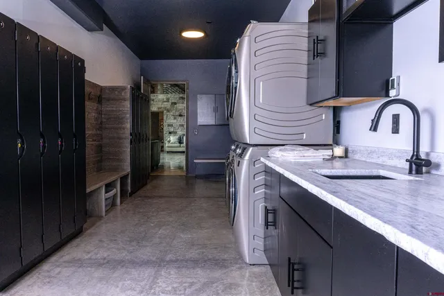 a view of water heater room with stairs