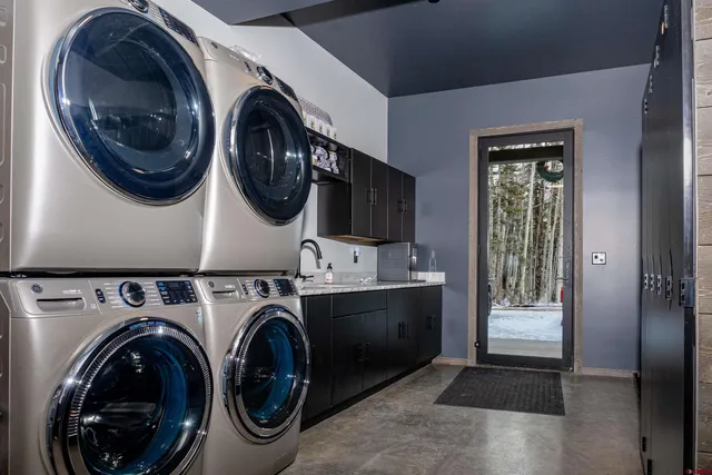 a hallway with a large stone wall