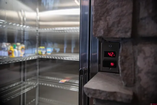 a kitchen with stainless steel appliances granite countertop a sink and a stove