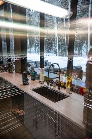 a kitchen with a sink and cabinets