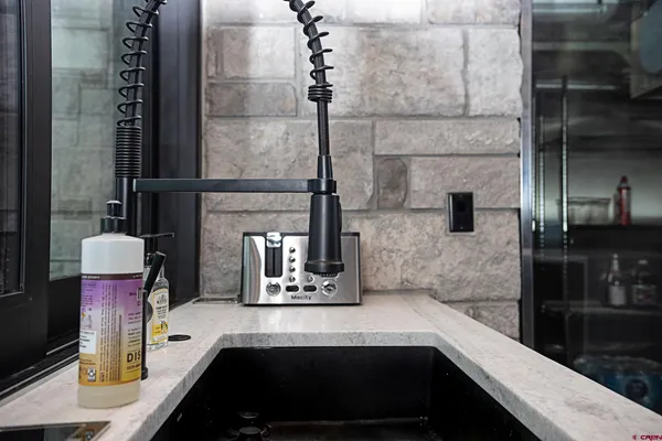 a bathroom with a sink and a washing machine