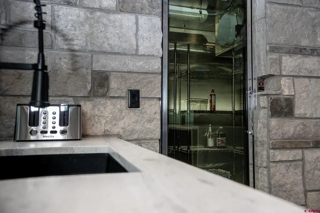 a kitchen with a sink and a counter top space