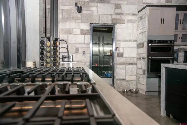 a kitchen with cabinets and appliances