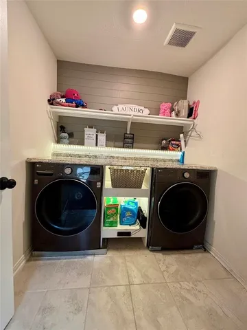 a utility room with dryer and washer