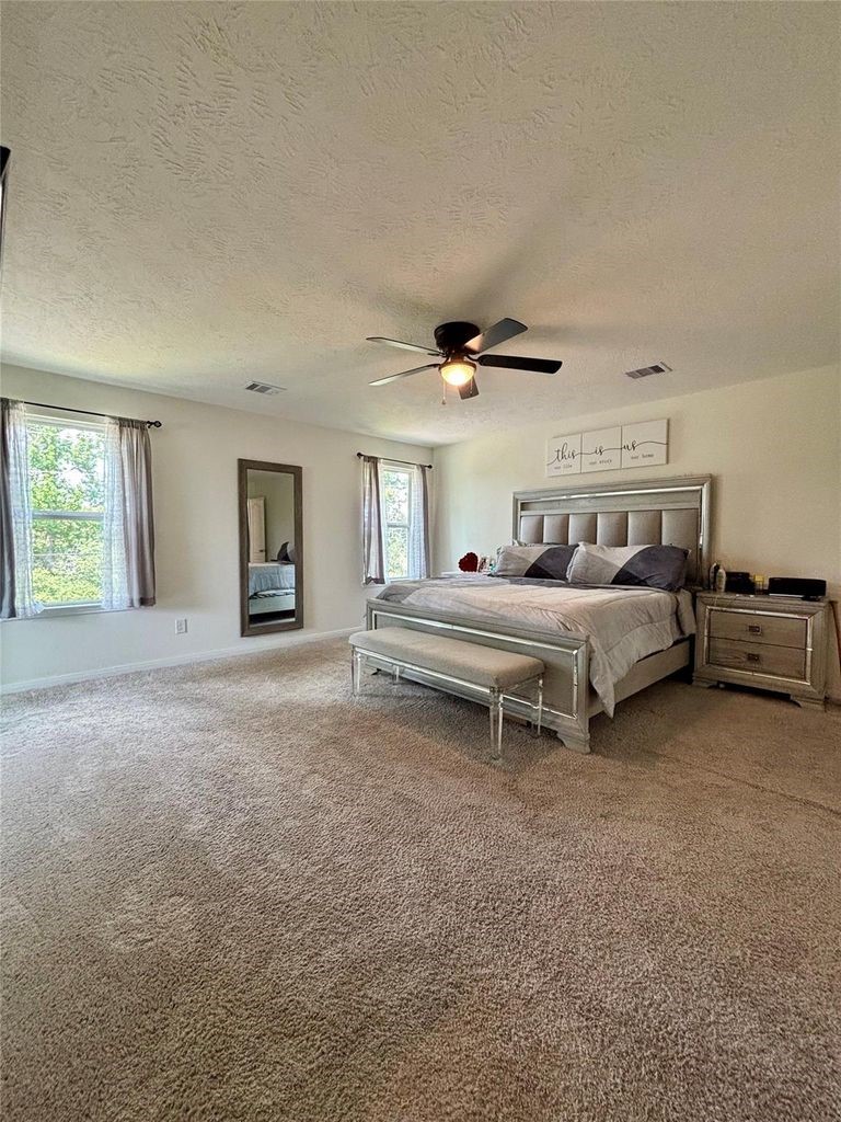 734 Hardwood Grv Court Houston, TX 77090 - Photo 16 of 23 a bed room with furniture and a window