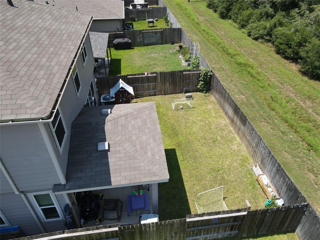 734 Hardwood Grv Court Houston, TX 77090 - Photo 22 of 23 an aerial view of a house with a swimming pool