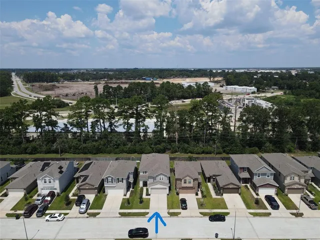 an aerial view of a yard with horses