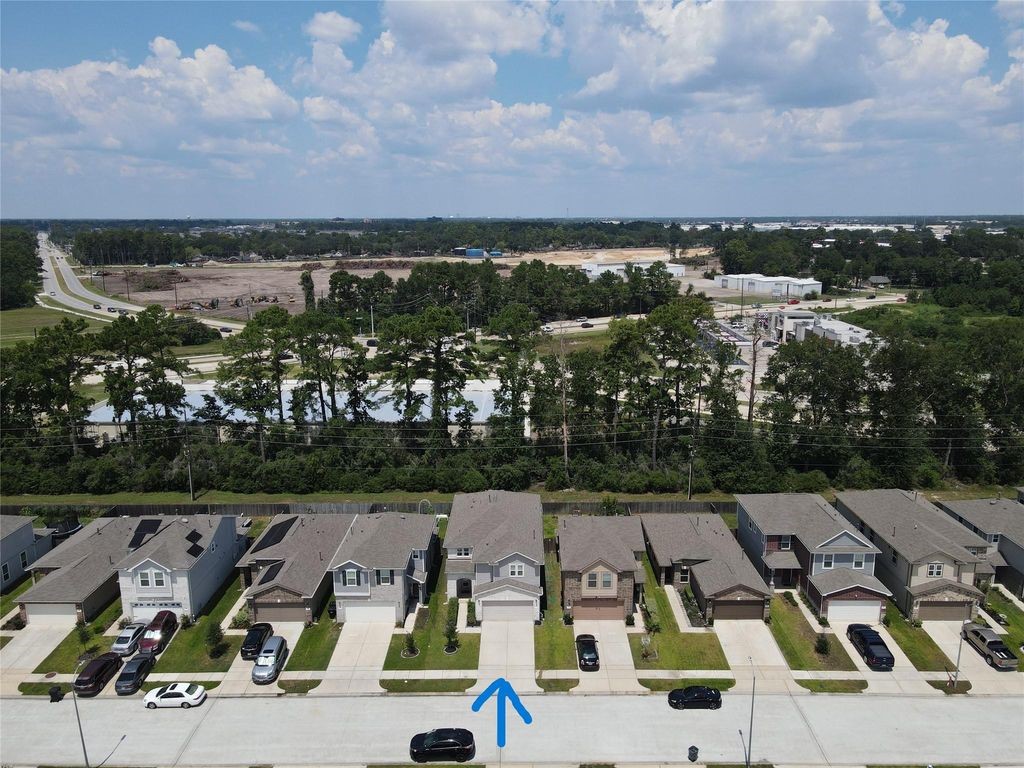 734 Hardwood Grv Court Houston, TX 77090 - Photo 23 of 23 an aerial view of a yard with horses