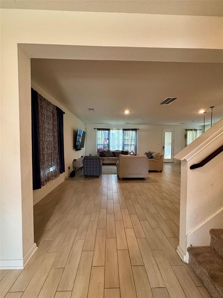 734 Hardwood Grv Court Houston, TX 77090 - Photo 6 of 23 a living room with furniture and a wooden floor