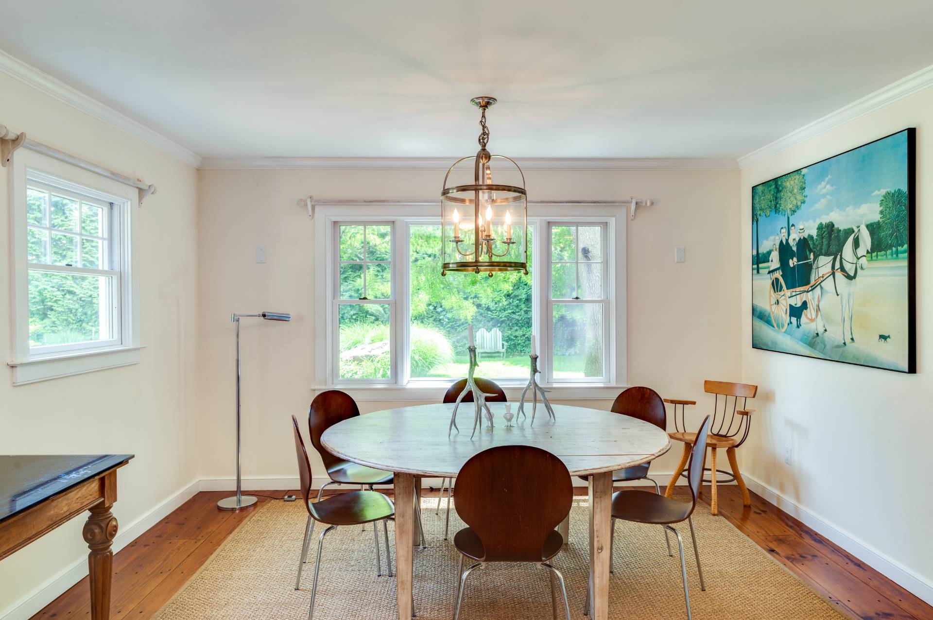 53 Hildreth Lane Bridgehampton, NY 11932 - Photo 17 of 37 a dining room with furniture a chandelier and wooden floor