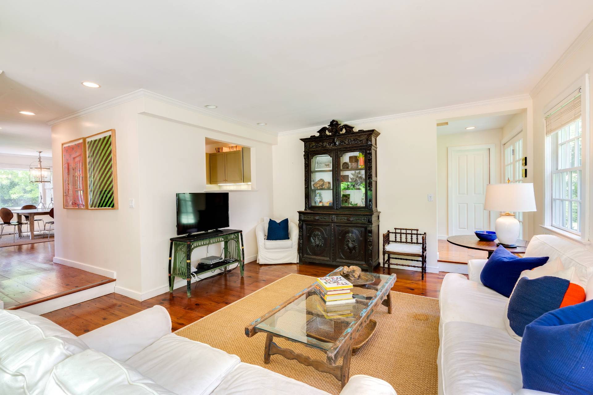 53 Hildreth Lane Bridgehampton, NY 11932 - Photo 22 of 37 a living room with furniture a fireplace and a flat screen tv