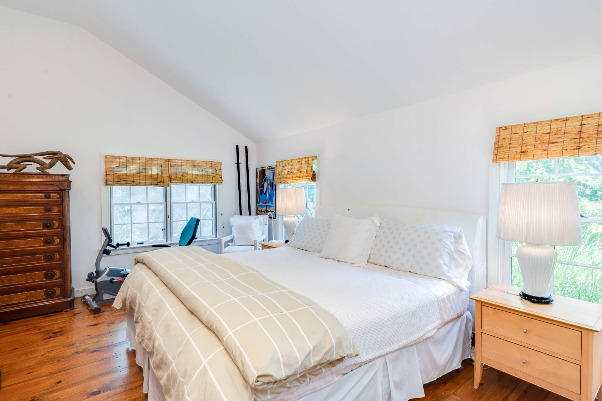 53 Hildreth Lane Bridgehampton, NY 11932 - Photo 24 of 37 a bedroom with a bed and a dresser next to a window