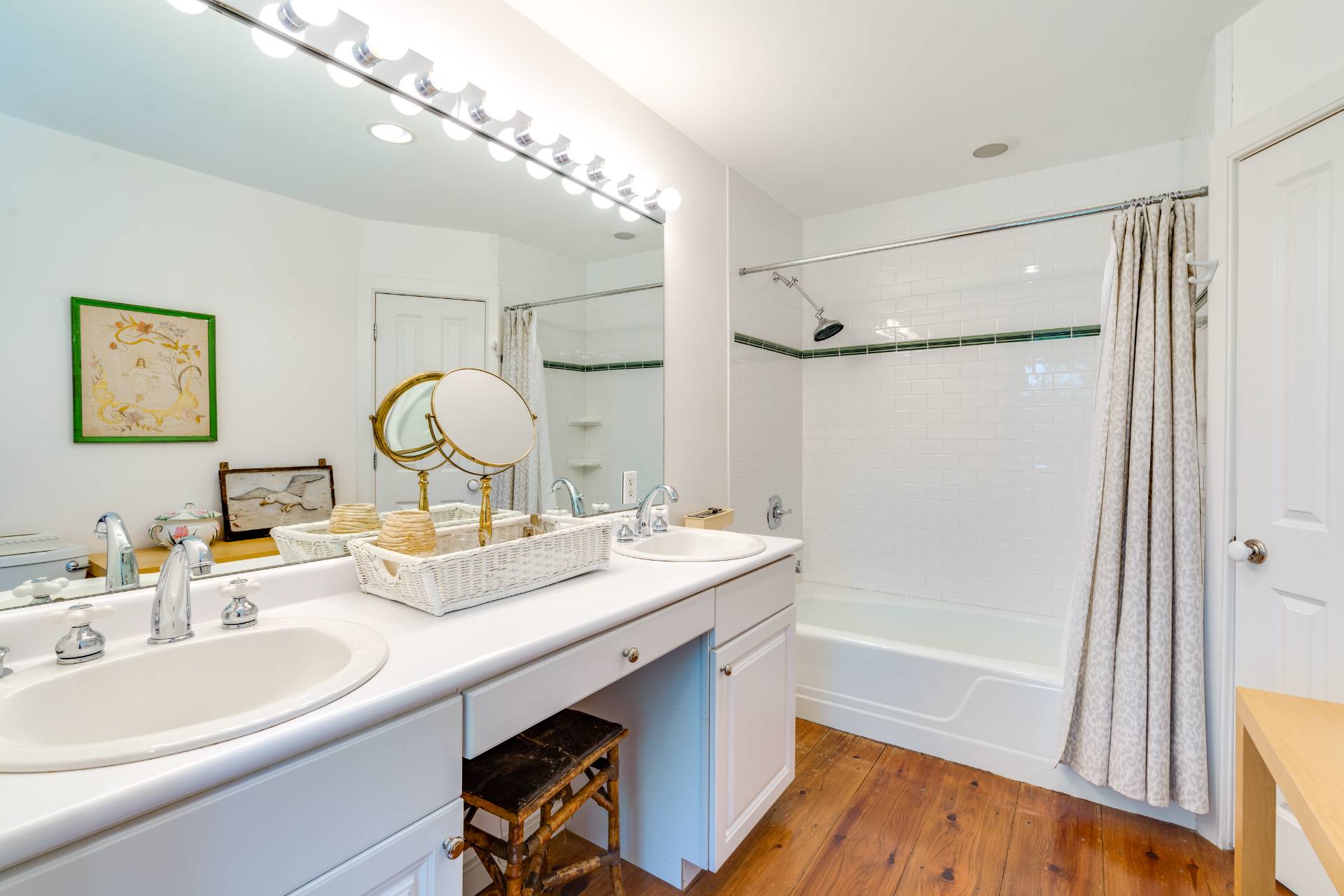 53 Hildreth Lane Bridgehampton, NY 11932 - Photo 27 of 37 a bathroom with a double vanity sink mirror toilet and bathtub