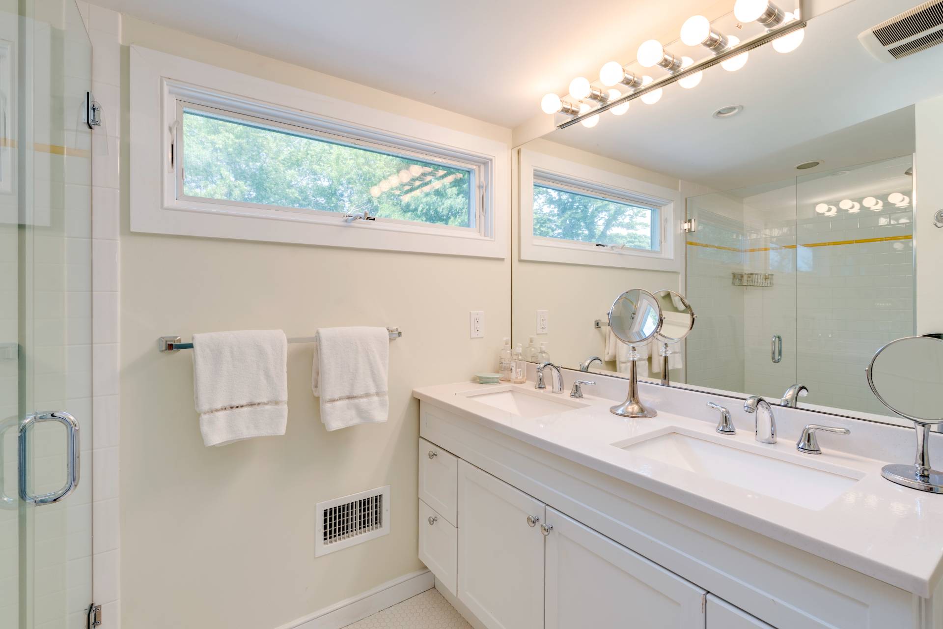 53 Hildreth Lane Bridgehampton, NY 11932 - Photo 35 of 37 a bathroom with a double vanity sink window and mirror