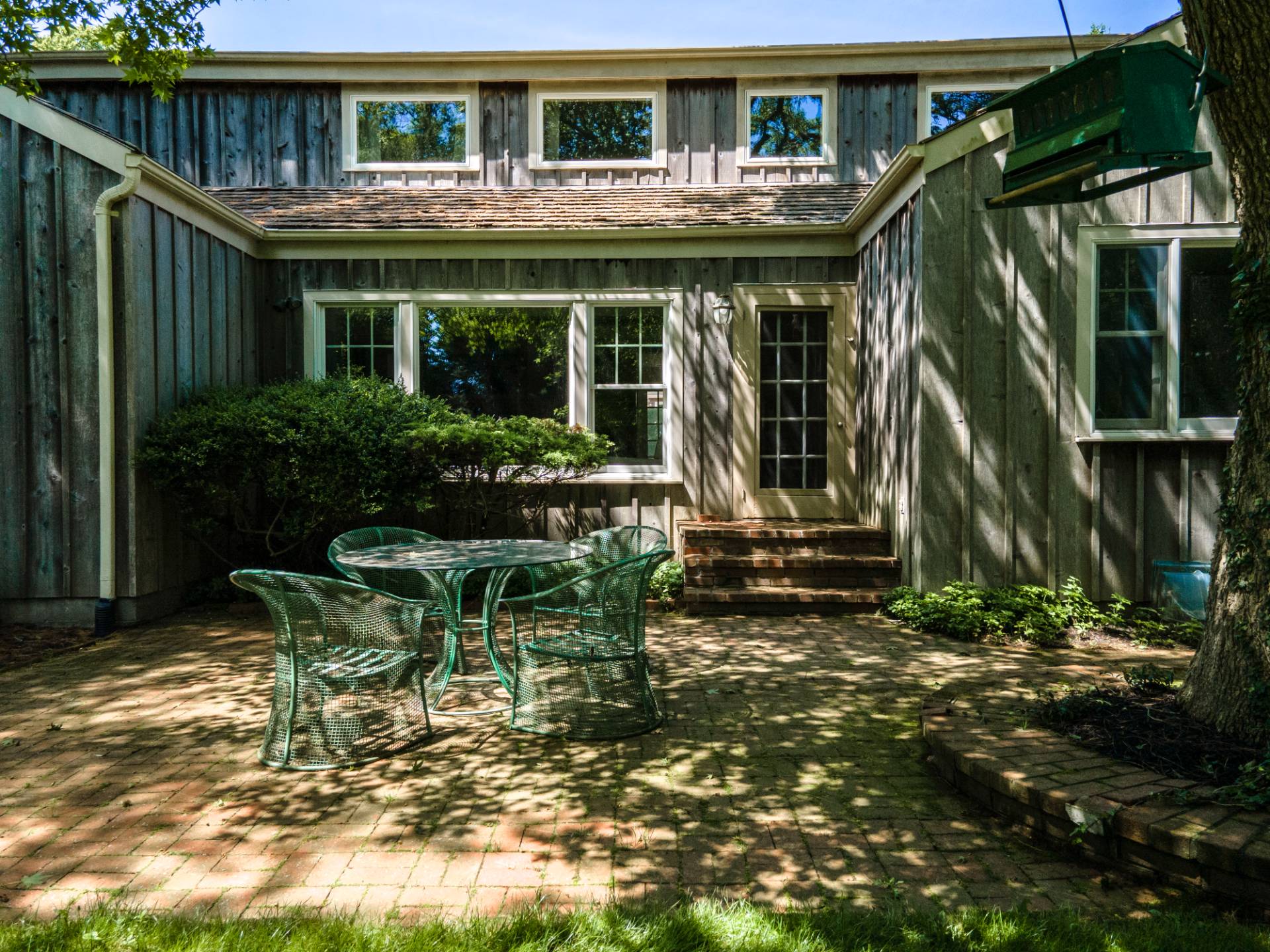 53 Hildreth Lane Bridgehampton, NY 11932 - Photo 5 of 37 a view of house with a chairs in patio