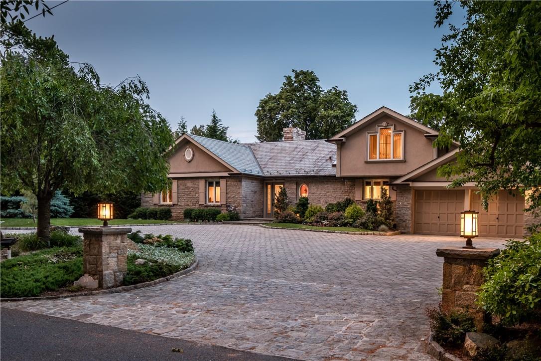 10 S Road Bronxville, NY 10708 - Photo 1 of 1 a front view of a house with a yard