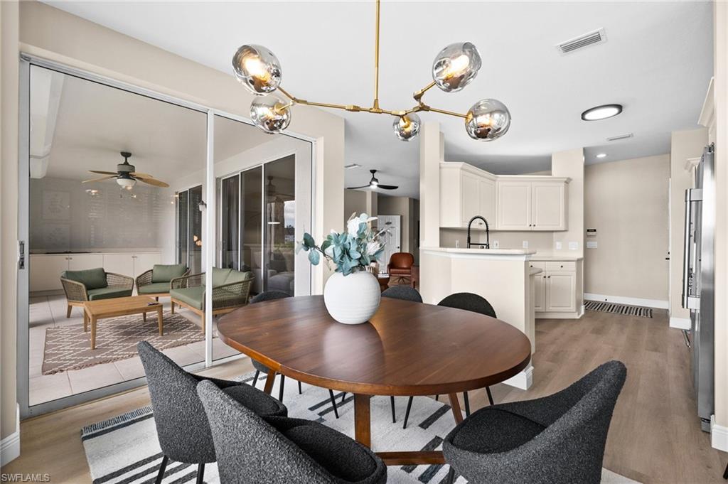 6080 Pinnacle Lane, Unit 1701 Naples, FL 34110 - Photo 11 of 39 a dining room with furniture and window