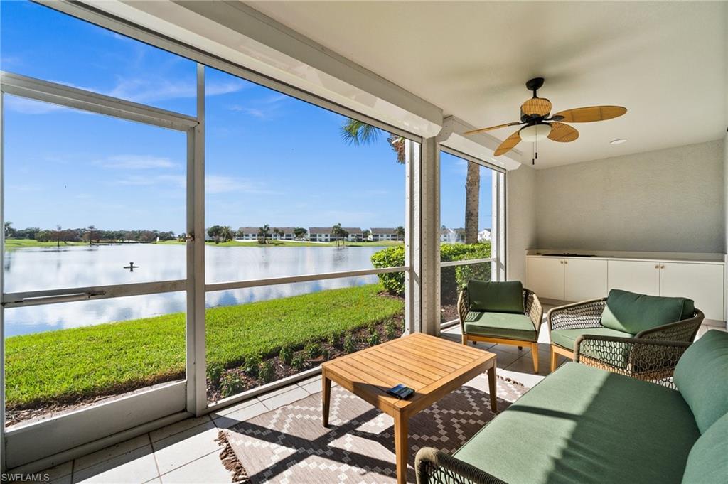 6080 Pinnacle Lane, Unit 1701 Naples, FL 34110 - Photo 31 of 39 a outdoor space with patio the couches and dining table with garden view