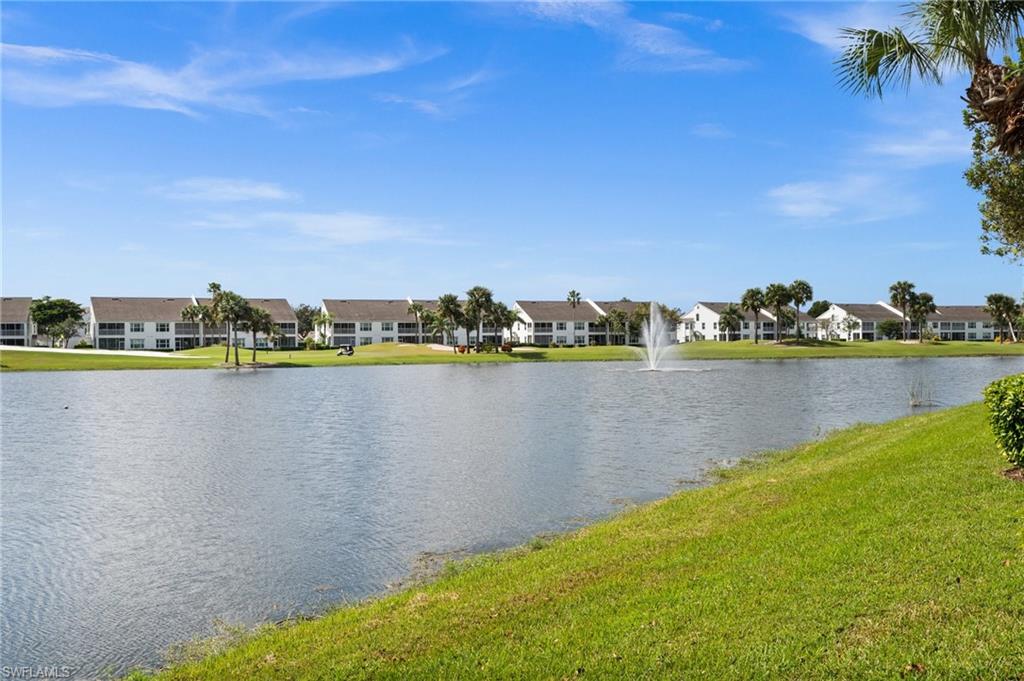 6080 Pinnacle Lane, Unit 1701 Naples, FL 34110 - Photo 33 of 39 a view of a lake with houses