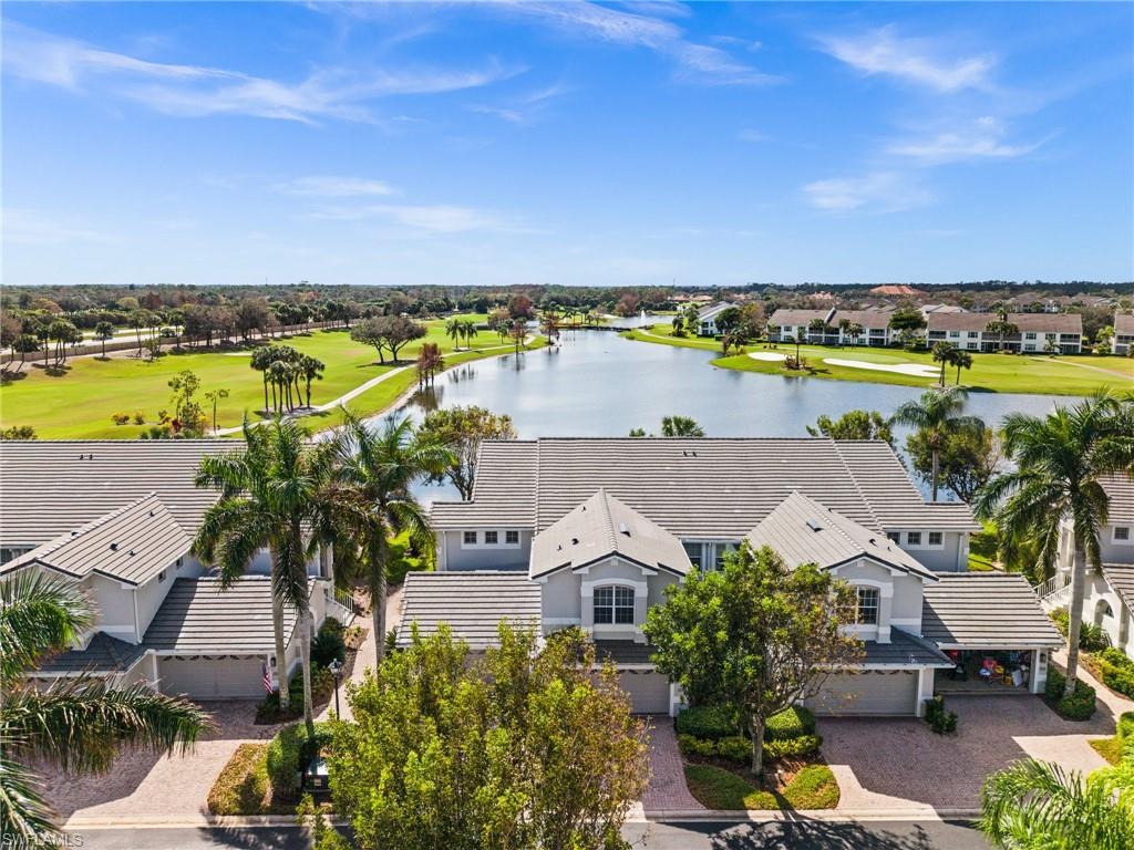 6080 Pinnacle Lane, Unit 1701 Naples, FL 34110 - Photo 34 of 39 an aerial view of a house with a lake view