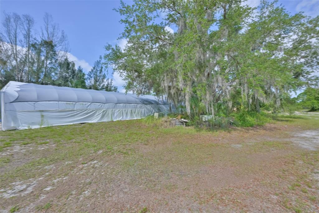 14451 Highland Road Wimauma, FL 33598 - Photo 20 of 80 a view of a backyard