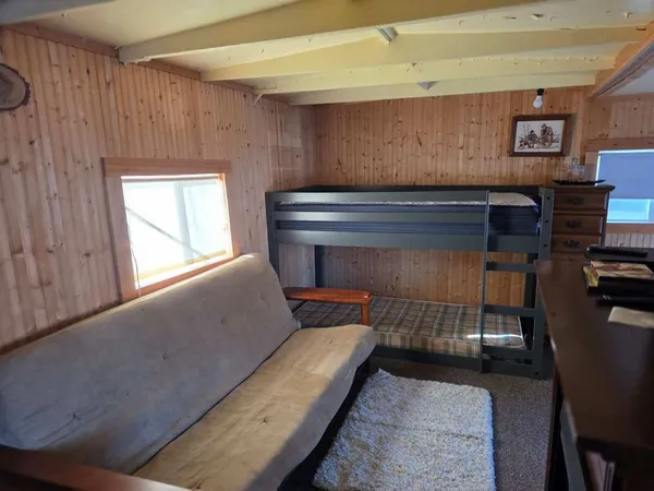 a living room with a couch and a window