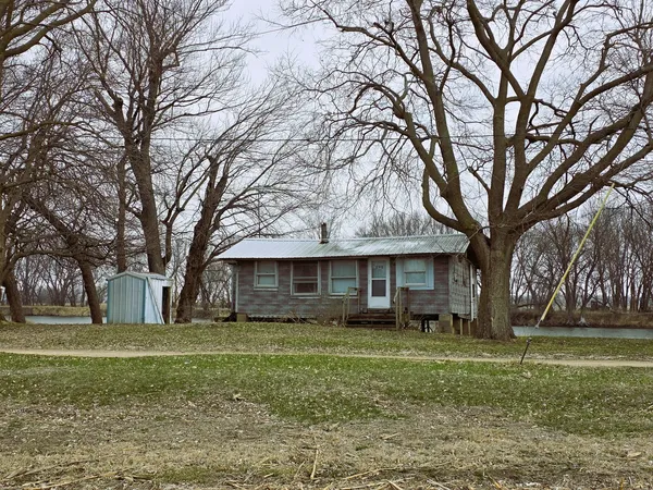 a view of house with a yard