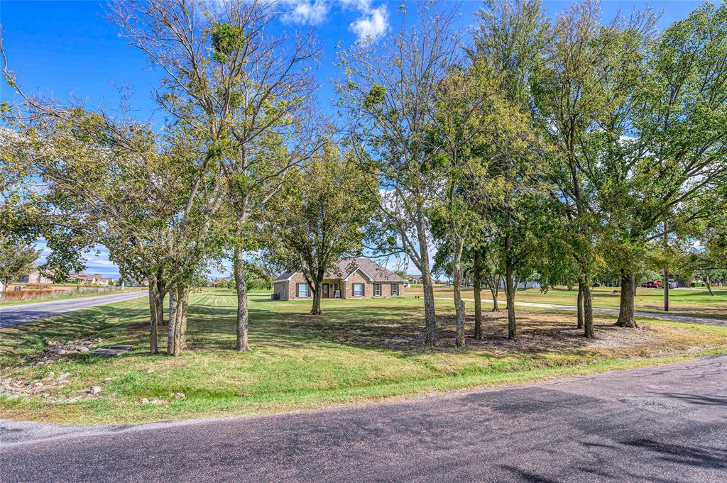 10264 Farmington Road Van Alstyne, TX 75495 - Photo 5 of 39 a view of a park with large trees
