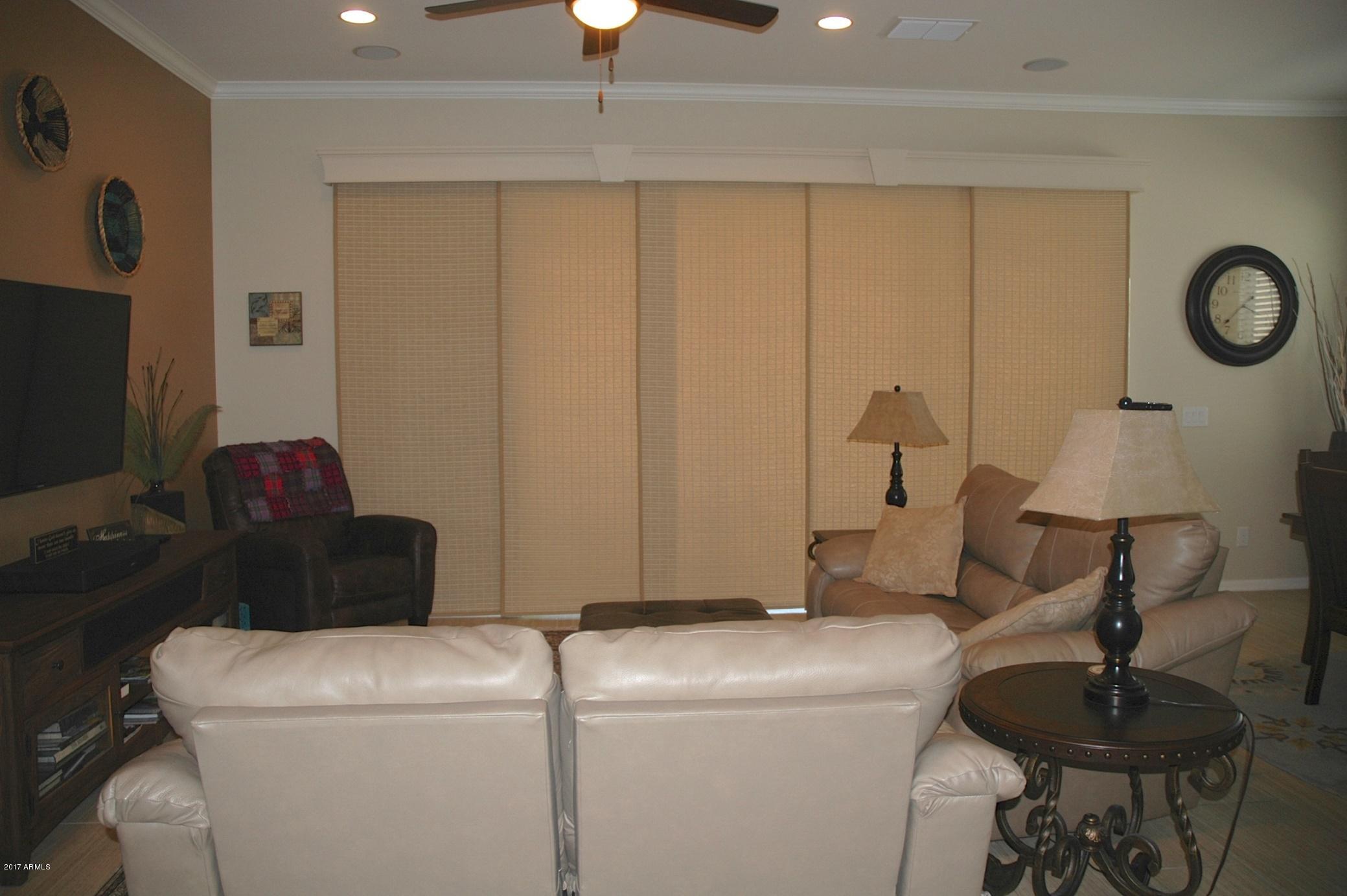 3838 East Rakestraw Lane Gilbert, AZ 85298 - Photo 12 of 47 livingroom with closed custom blinds.