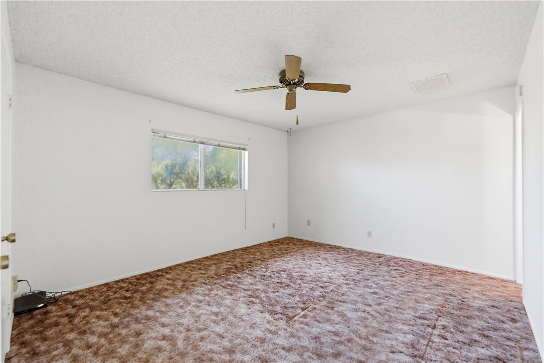 590 Ridgecrest Drive Kingman, AZ 86409 - Photo 22 of 33 a view of a big room with wooden floor and windows