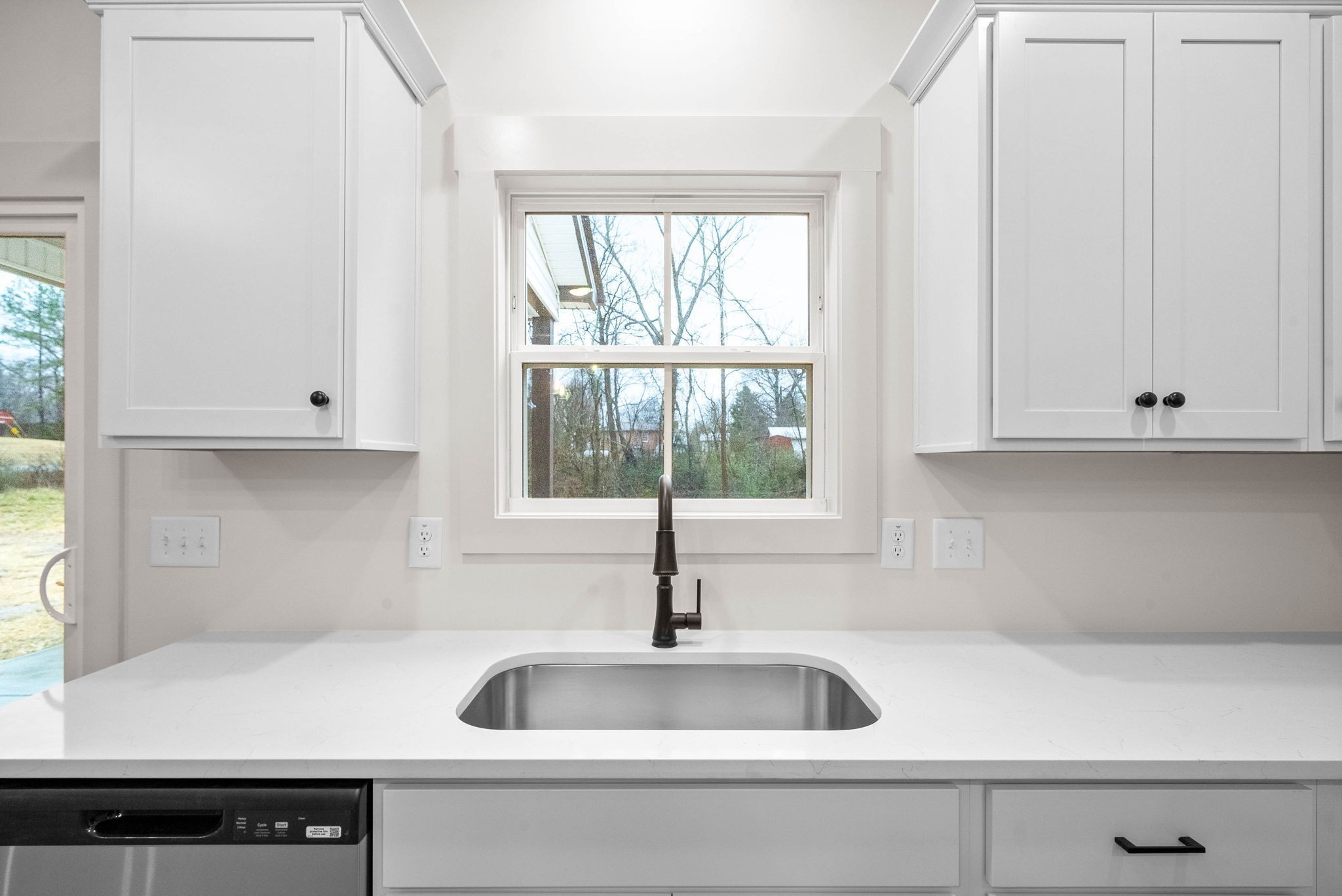 193 Dewberry Road Clarksville, TN 37042 - Photo 12 of 30 a kitchen with granite countertop a sink and a window