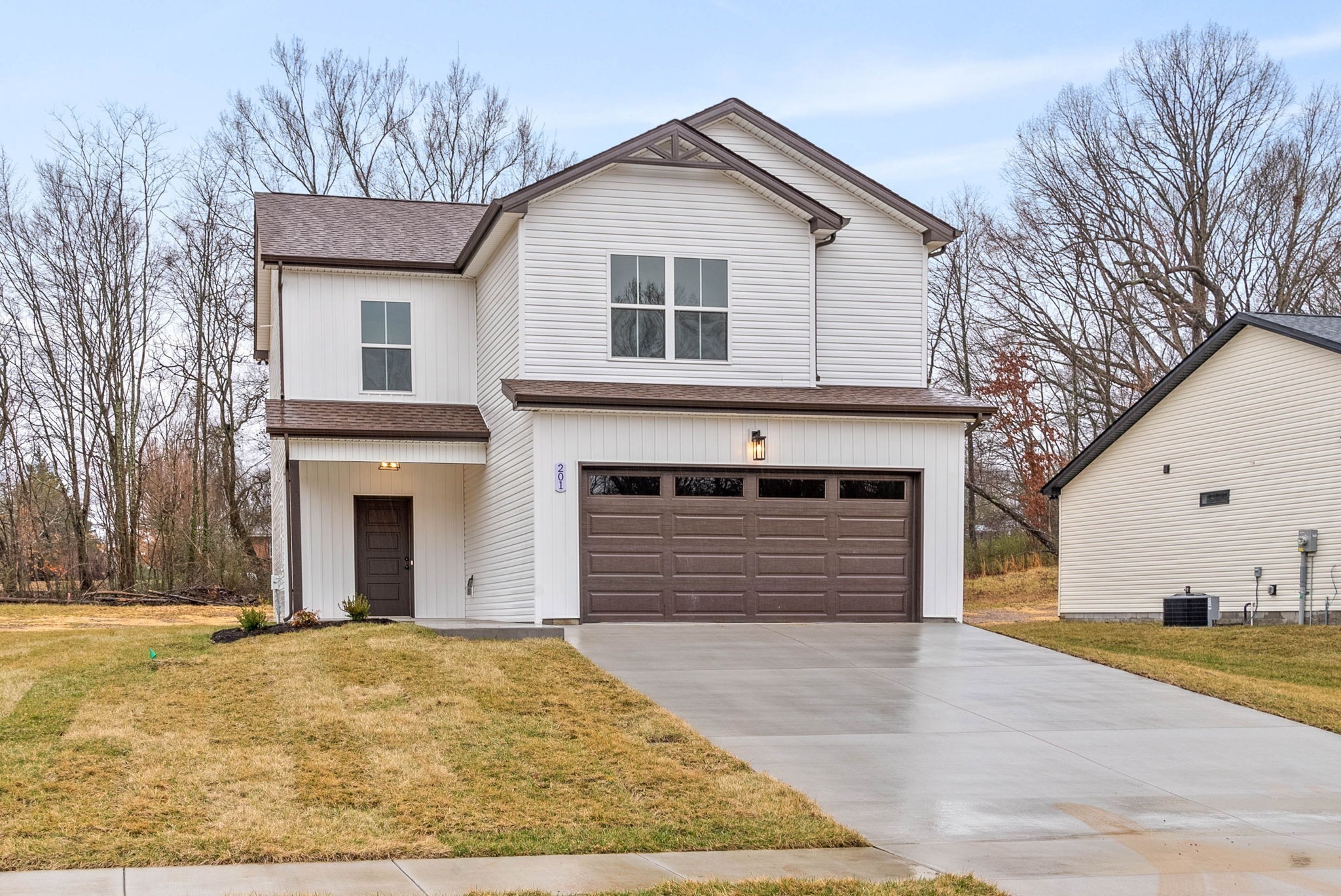 193 Dewberry Road Clarksville, TN 37042 - Photo 2 of 30 a front view of a house with a yard and garage